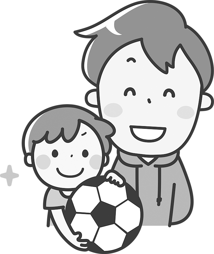 子どもにサッカーを教える指導者